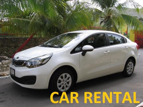 a white car parked in a parking lot at Lagoon Ocean Resort in Lagun