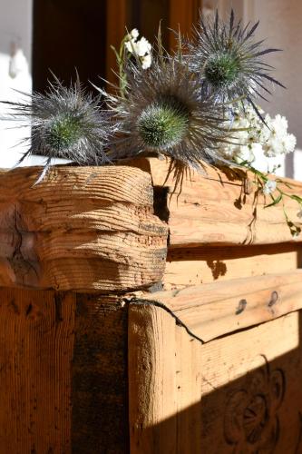 a wooden box with plants on top of it at Hotel de Moiry Supérieur in Grimentz