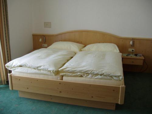 Postel nebo postele na pokoji v ubytování Haus Heigl