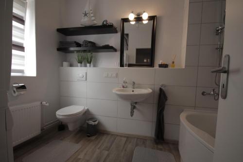 Ένα μπάνιο στο Ferienwohnung Come Home 1