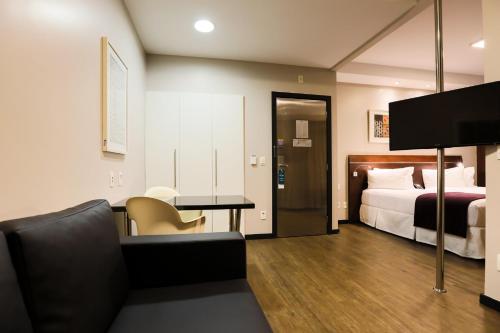 Katil atau katil-katil dalam bilik di San Diego Suites Ipatinga
