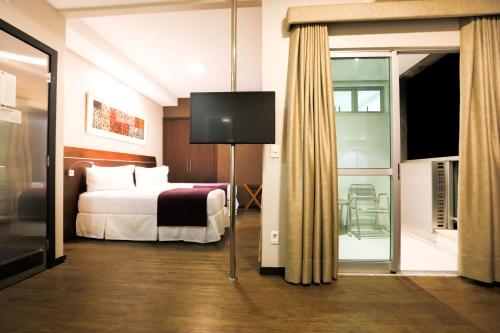 Katil atau katil-katil dalam bilik di San Diego Suites Ipatinga