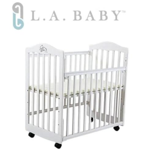 a baby crib in white with black wheels at 3 Bedrooms and 1 Study and 3 Bathrooms Near Taipei 101 & MRT in Taipei