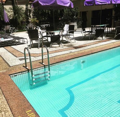 Kolam renang di atau dekat dengan Loft Confortável e Moderno