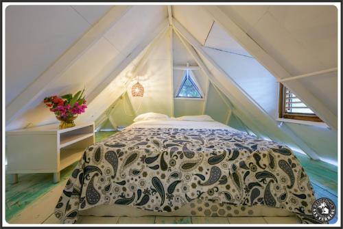a bedroom with a bed in a tent at Résidence San Ferreol in Las Terrenas