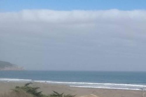 a view of the ocean from a beach at Loft Playa Puertecillo, mar y sunset increíble in Puertecillo