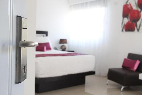 Ένα ή περισσότερα κρεβάτια σε δωμάτιο στο Hostal San Francisco de Asis