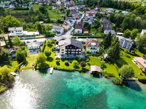 an aerial view of a house next to a river at Seepension Smoley in Villach