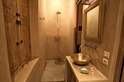 a bathroom with a sink and a shower at Riad De Vinci & SPA in Marrakech
