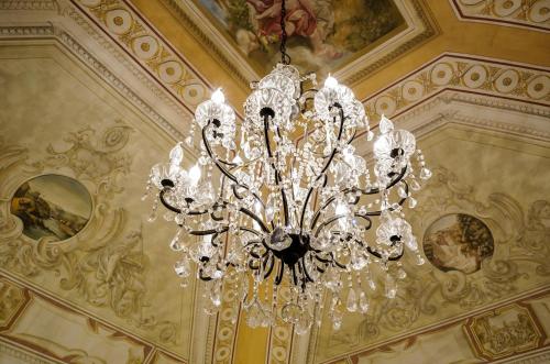 a chandelier hanging from a ceiling in a building at Al Palazzetto in Tivoli