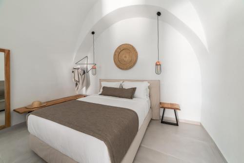 Postel nebo postele na pokoji v ubytování Echo Caves Suites