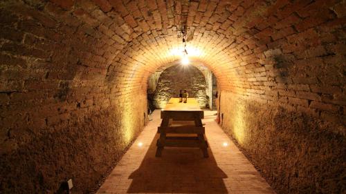 a tunnel with a row of benches in it at Penzion U Kapličky in Znojmo