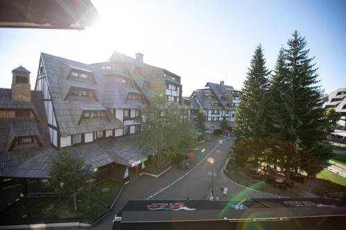 arial view of a city with buildings and trees at Apartments Suncani Vrhovi Kopaonik in Kopaonik