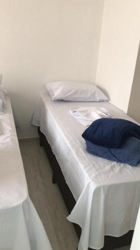 Ένα ή περισσότερα κρεβάτια σε δωμάτιο στο Pousada Anjos da Montanha