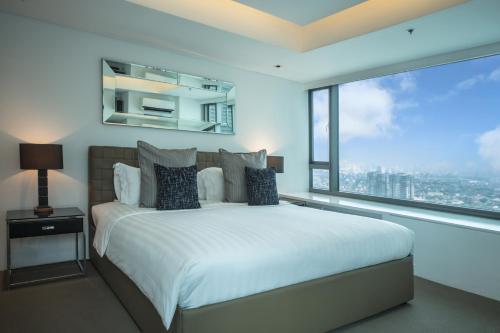 Ένα ή περισσότερα κρεβάτια σε δωμάτιο στο The Alpha Suites
