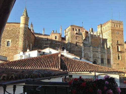a view of a building with a tile roof at Hostal Cerezo 2 in Guadalupe