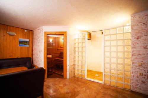 a room with a hallway with a glass door at 12 Місяців-Травень, басейн з підігрівом in Slavske