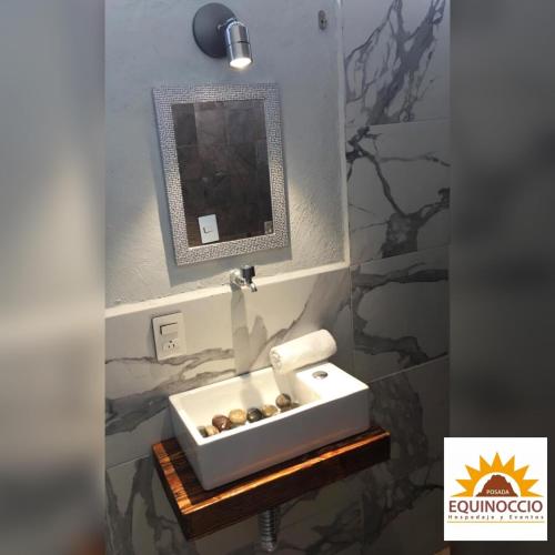 a bathroom with a sink and a mirror at Posada Equinoccio in Bernal