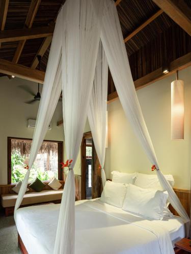 Ένα ή περισσότερα κρεβάτια σε δωμάτιο στο The Trang Villas