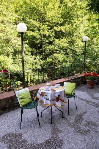 a table and two chairs sitting on a patio at Il Rifugio in Pracchia