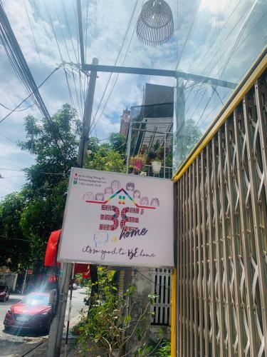 a sign on the side of a building at Be's Home & Tours in Ha Giang