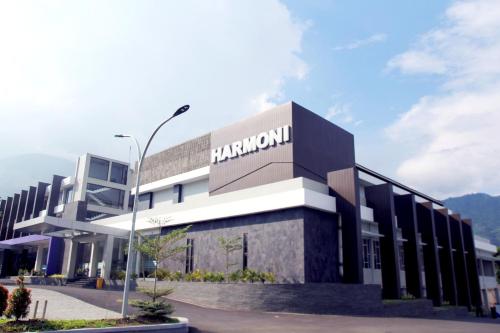 a building with a sign on the side of it at Harmoni Hotel Garut in Garut