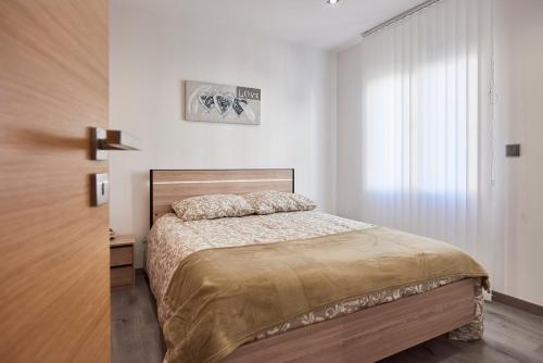 Ένα ή περισσότερα κρεβάτια σε δωμάτιο στο A L'Ombre du Pin "6" - Bright T2 near Disneyland and Paris, 1-4 Guests