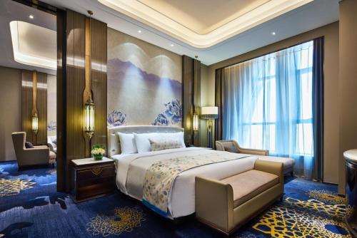Krevet ili kreveti u jedinici u okviru objekta Wanda Vista Hotel Urumqi
