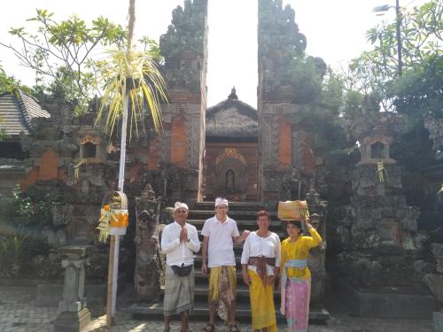 a group of people standing in front of a building at Taman Anyar Homestay in Ubud
