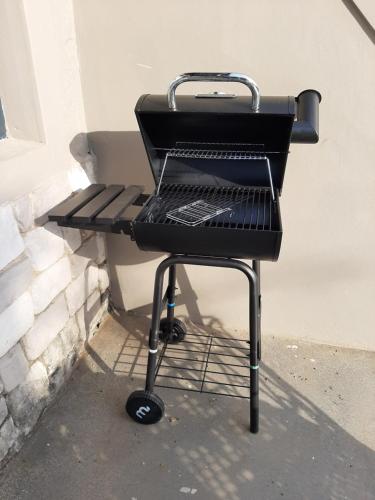 a grill with a laptop on top of it at Studio 5 The Studios at Churchill in Hillcrest