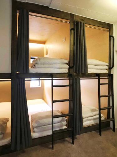 a group of bunk beds in a room at Seoul Cube Itaewon in Seoul