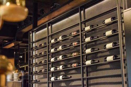 a rack of wine bottles in a wine cellar at De Borgh in Zevenbergen