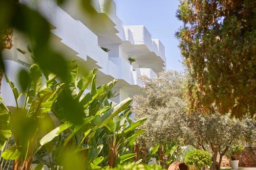 a building with green plants in front of it at Hotel Rocamarina - Adults Only in Cala d´Or