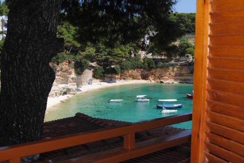 a view of a beach with boats in the water at Pension Dimitris in Votsi
