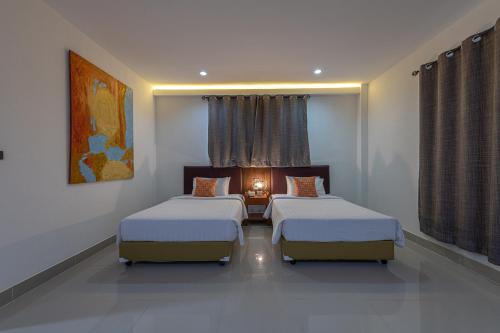Katil atau katil-katil dalam bilik di Blue Beach Apartment