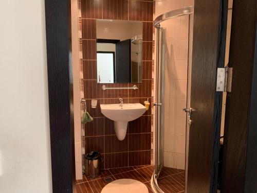 a small bathroom with a sink and a mirror at Apartment with terrace in Spa Complex in Burgas