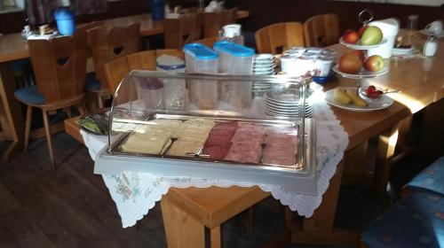a table with a tray of food on a table at Hotel Bayerischer Hof in Wiesau