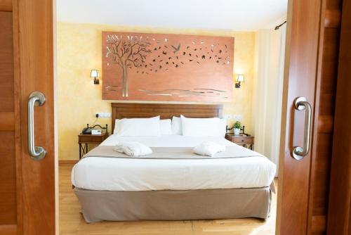 Posteľ alebo postele v izbe v ubytovaní Hotel Comendador