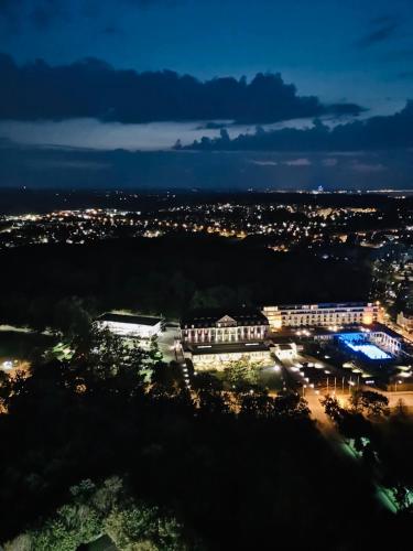a view of a city at night at Blue City Apartments in Lübeck