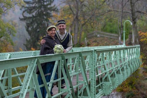 a man and woman standing on a bridge at Burg Plankenstein in Texing