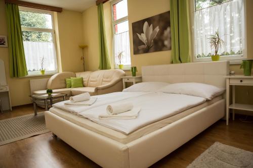 מיטה או מיטות בחדר ב-Penzion Burra