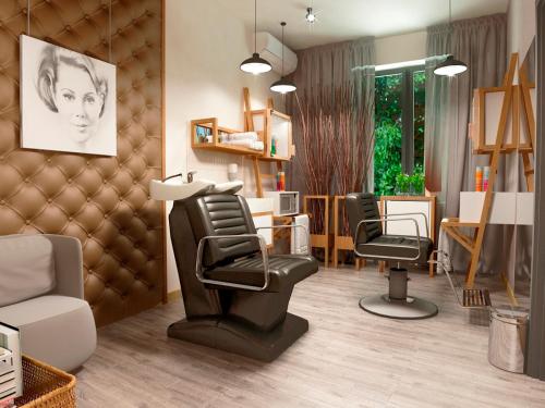 a living room with chairs and a hair salon at Hotel Vesna in Truskavets
