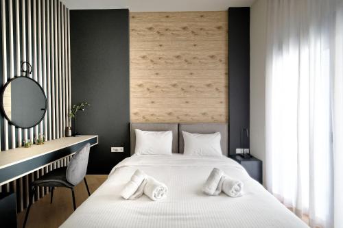 A bed or beds in a room at Muses Residence