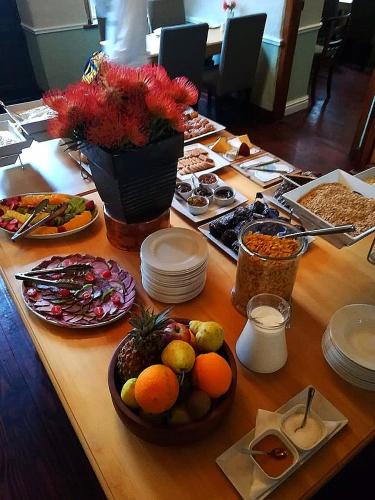 a table with a bunch of food on it at Zevenwacht Country Inn in Kuilsrivier