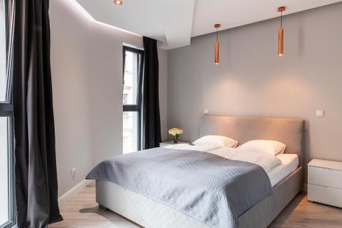 Postel nebo postele na pokoji v ubytování Apartament Miedziany