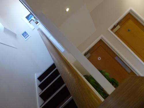 a staircase in a house with a stair case at Boathouse Hotel in Hythe