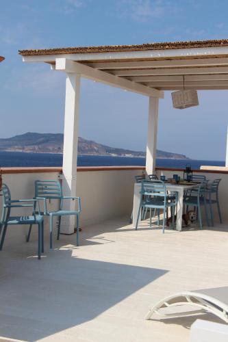 a group of chairs and tables on a roof at Lanterna sul mare in Favignana