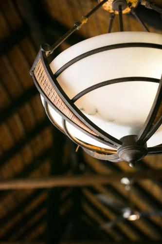 a light fixture hanging from a ceiling at Premier Resort Mpongo Private Game Reserve in Macleantown