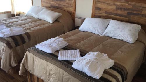 Letto o letti in una camera di Inti Illimani Lodge