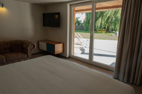 Postel nebo postele na pokoji v ubytování Villa Farfalla